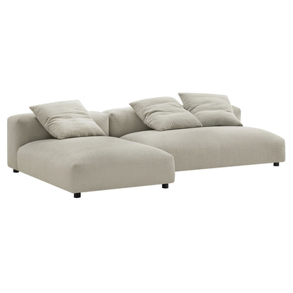 Beige linen sectional sofa with left chaise, low arms, three back cushions for modern living room seating.