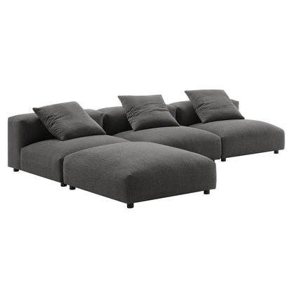 Dark gray fabric modular sectional with chaise on the left, three back cushions, and three matching throw pillows.