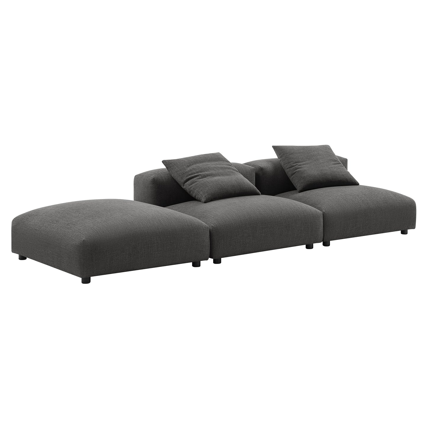 Dark gray fabric modular sectional sofa with chaise on left & coordinating cushions, low black legs.