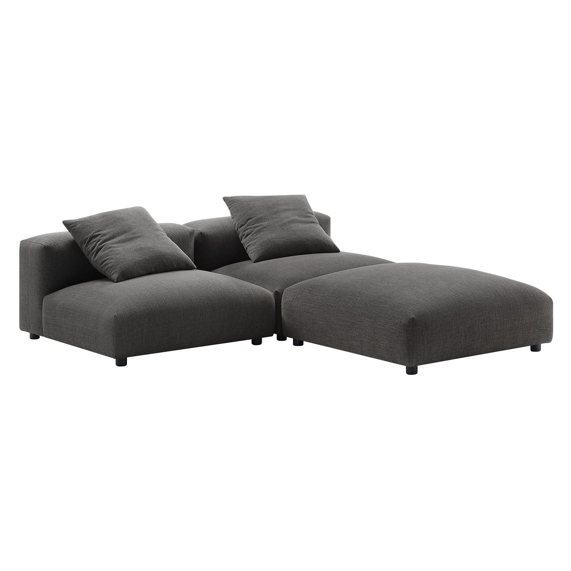 Charcoal gray fabric sectional with chaise, low-profile modular design and two matching cushions.