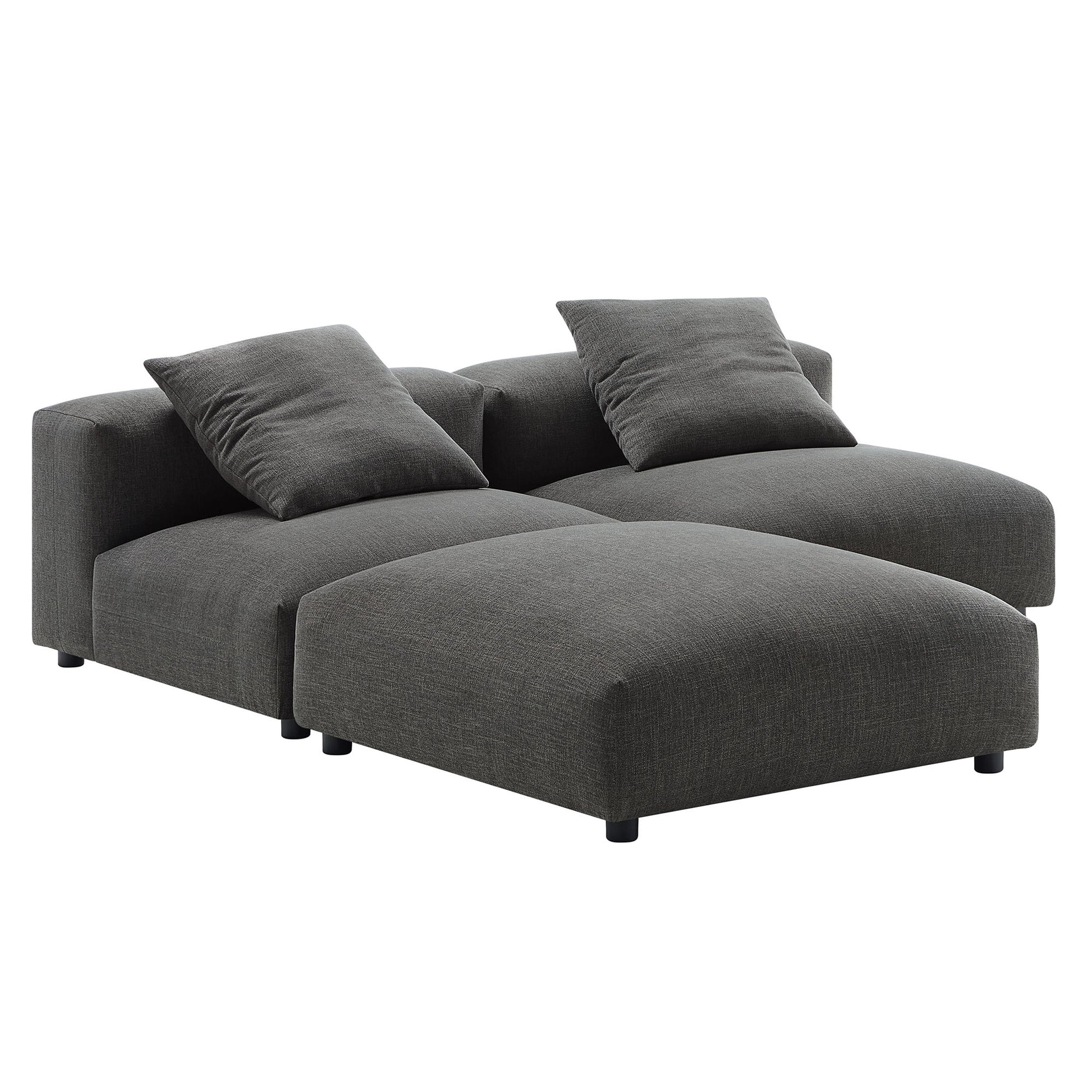 Dark gray fabric sectional sofa with chaise, low-profile arms, two matching cushions, modern contemporary design.
