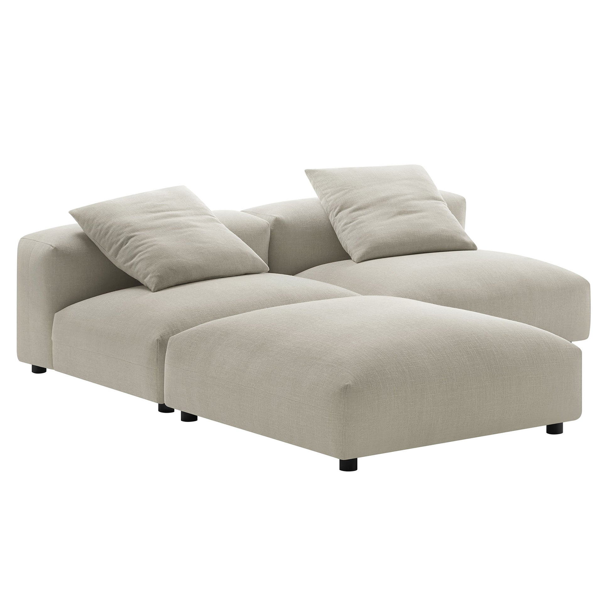 Brown fabric sectional sofa with chaise and low-profile black legs, two matching throw pillows.