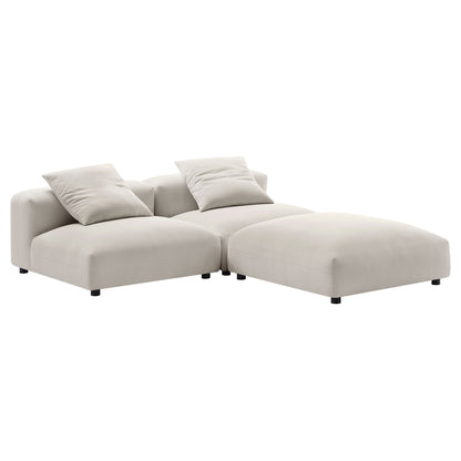 Brown fabric sectional with chaise on the right and two matching throw pillows, low-profile modular design.
