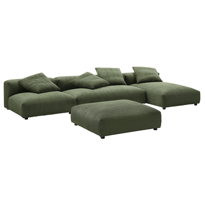 Forest green ribbed fabric modular sectional with chaise and matching ottoman, plump cushions.