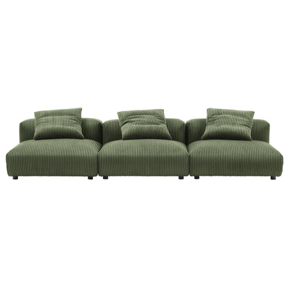 Green ribbed fabric modular sectional sofa with three seats and matching throw pillows.