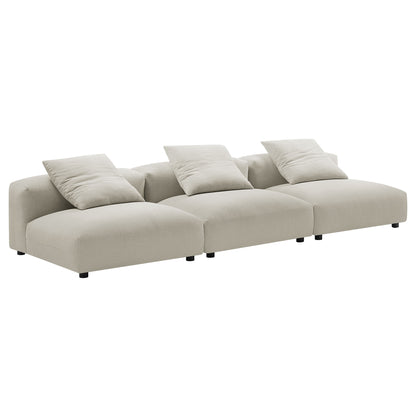 Brown modular sectional fabric sofa with three seats, four throw cushions, low black legs, contemporary style.