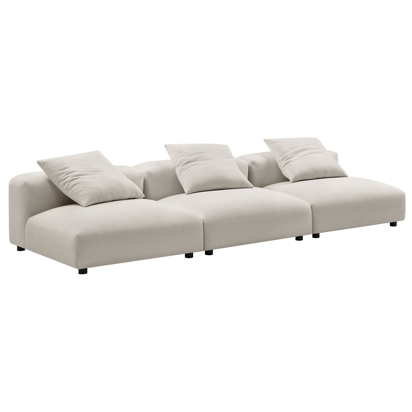Gray modular sectional sofa with three connected seats, plush back cushions, low-profile frame, short black legs.