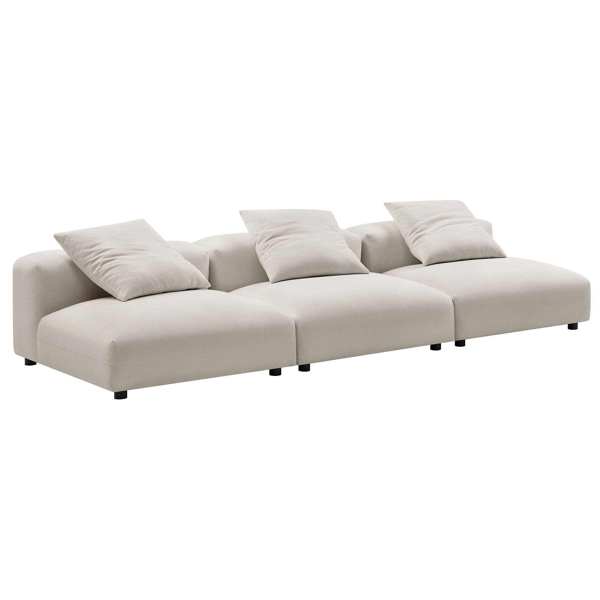 Gray modular sectional sofa with three connected seats, plush back cushions, low-profile frame, short black legs.