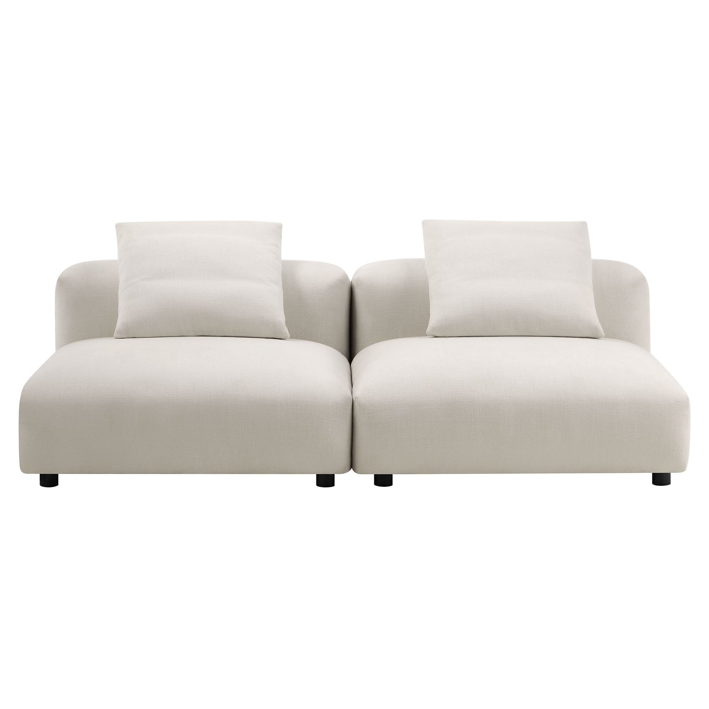 Gray modular sofa with two connected seats, cushioned arms, two throw pillows, low-profile design and short dark legs.