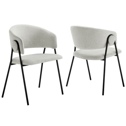Pair of black upholstered dining chairs with curved backs and dark metal legs in heathered chenille fabric.