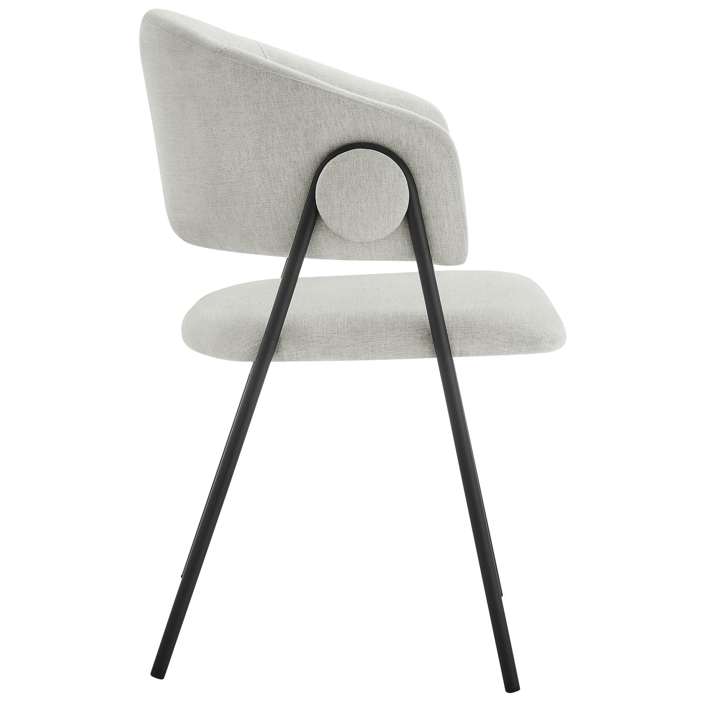 Pair of black upholstered dining chairs with rounded back cushions, heathered chenille fabric, and black metal legs in a minimalist mid-century design.