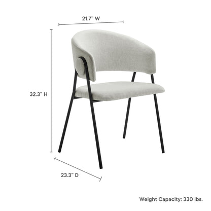 Light gray upholstered chair with curved back and arms, slim black metal legs; modern accent/dining chair.