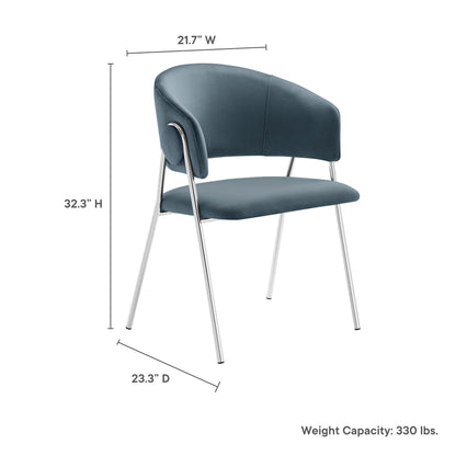 Blue velvet dining chair with curved back, padded seat, chrome legs; 21.7W x 32.3H x 23.3D.