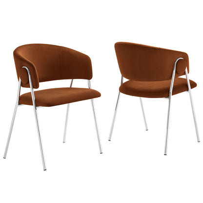 Two silver velvet dining chairs with curved backs, wraparound chrome arm supports and slender chrome legs.