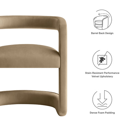 Taupe velvet chair with barrel back, curved frame, dense foam padding & stain-resistant upholstery.