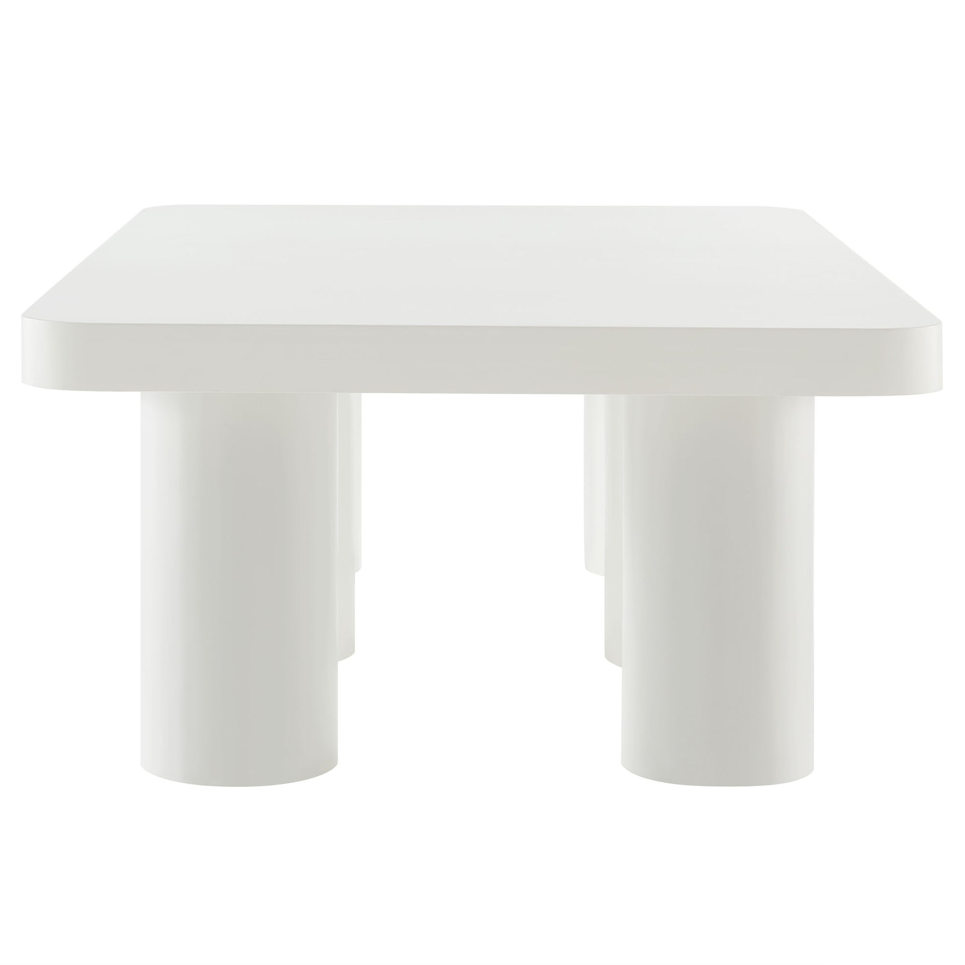 White rectangular coffee table with rounded corners and chunky cylindrical legs.