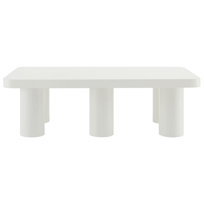 White rectangular coffee table & three chunky cylindrical legs, minimalist modern design.