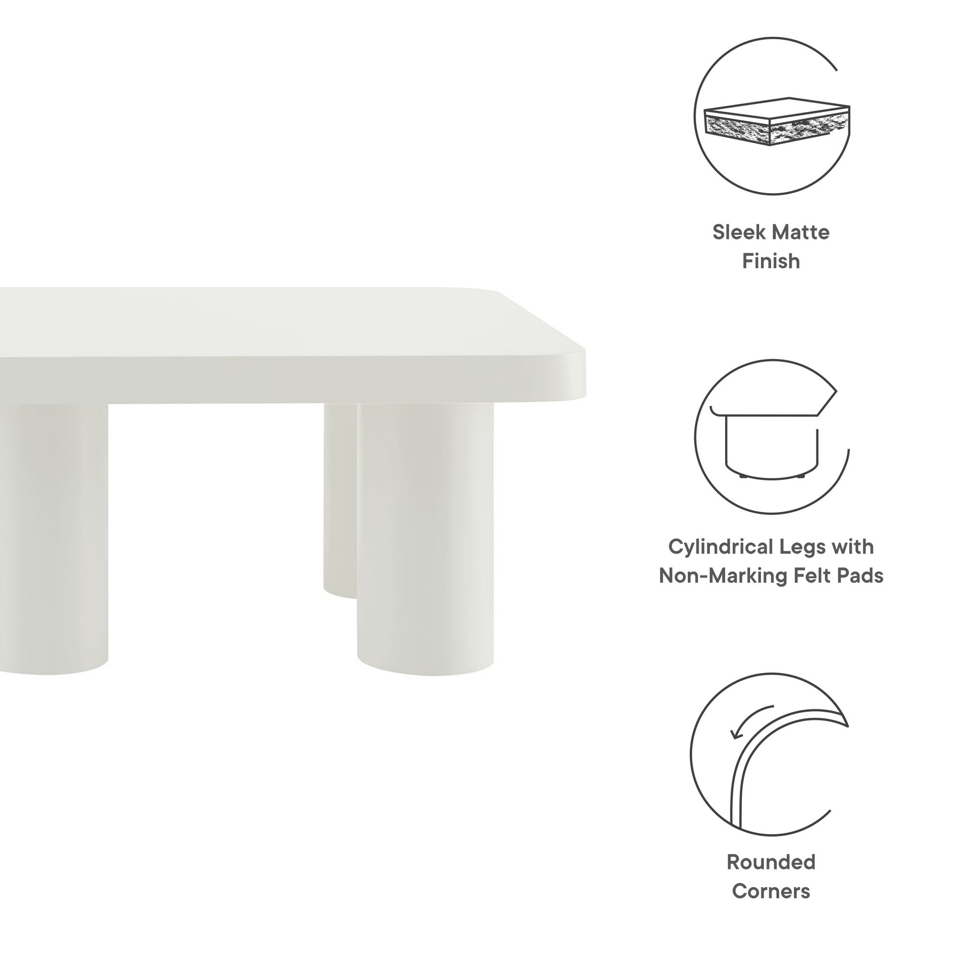 White rectangular coffee table with matte finish, cylindrical legs with felt pads, and rounded corners.