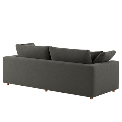 Dark gray fabric sleeper sofa with low arms, three seat cushions & tapered wooden legs for a modern living room.