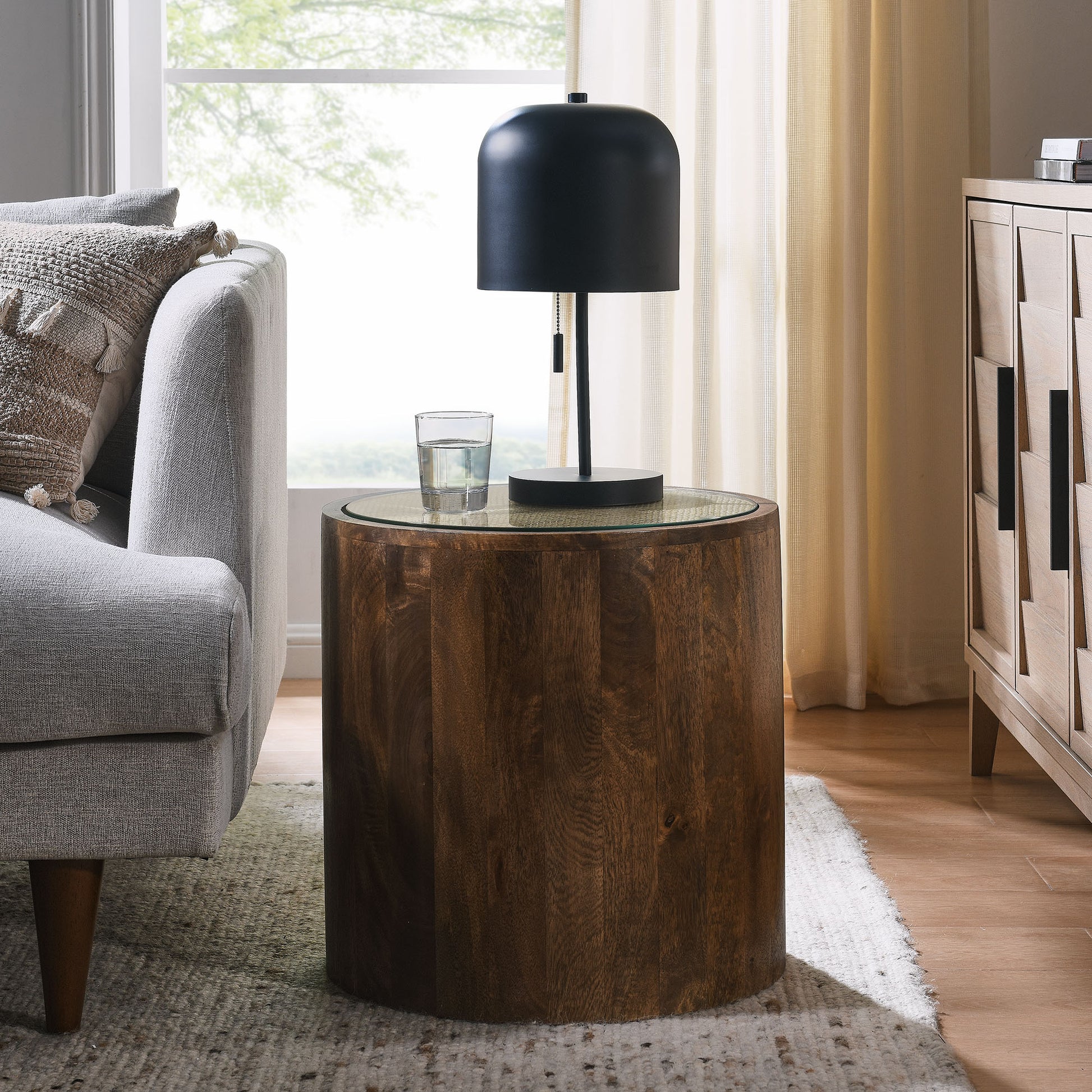 Round wood and rattan side table.