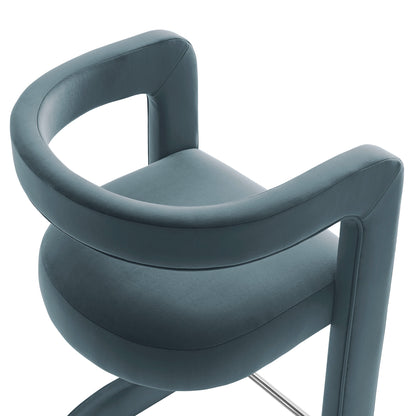 Teal blue upholstered counter stool with curved back and rounded seat on a chrome pedestal base.