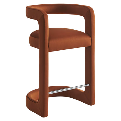 Rust-brown upholstered counter stool with wraparound curved frame, round cushioned seat, and metal footrest.