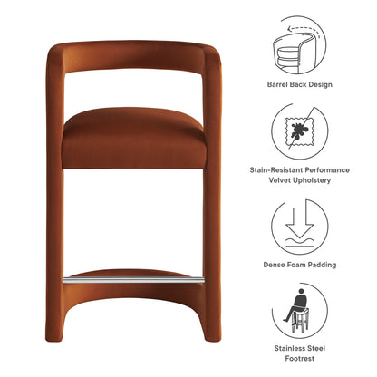 Brown velvet counter stool with a barrel-back design, curved arms, dense foam padding, and a stainless steel footrest.