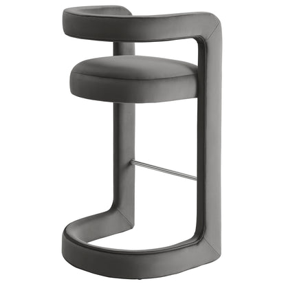 Grey upholstered bar stool with circular cushion and wraparound armrest on a metal cantilever base.