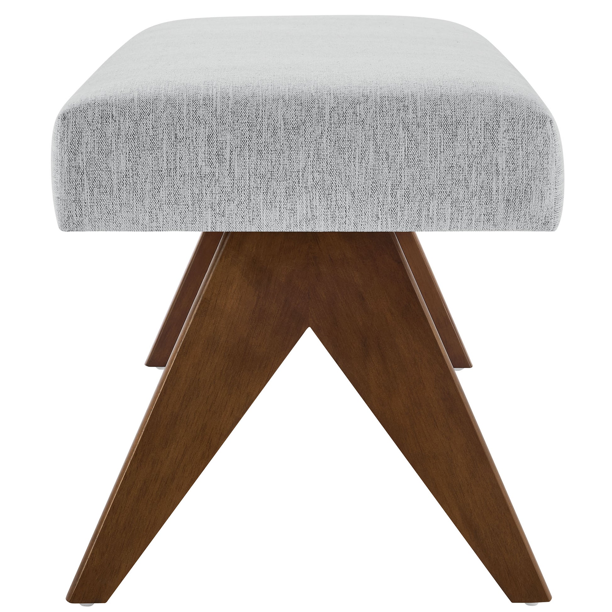 Grey fabric upholstered bench with brown wooden X-frame legs, mid-century modern.