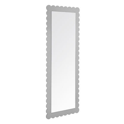 Tall rectangular floor mirror with a scalloped light gray frame.