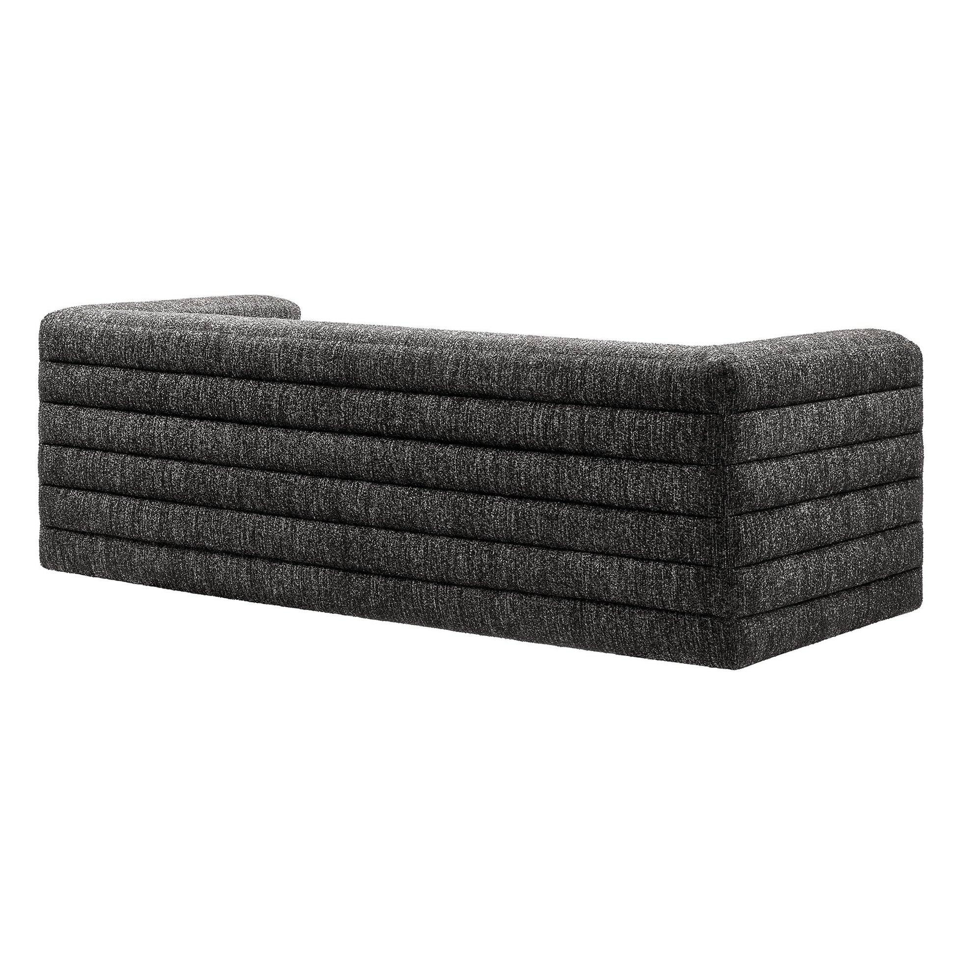Charcoal gray fabric long modular sofa with horizontal channel cushions and a low-profile rectangular silhouette.