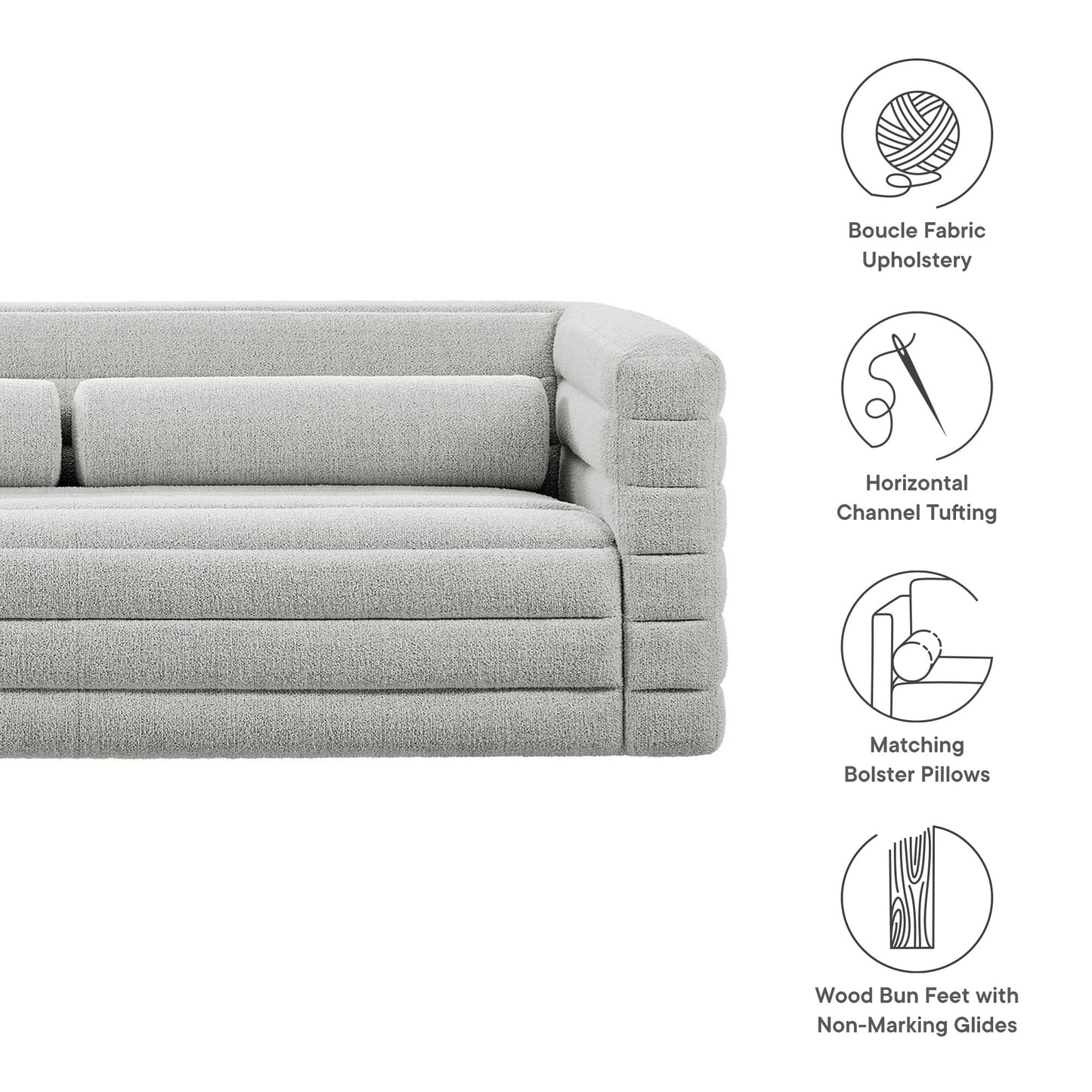 Light gray boucle fabric sofa with channel tufting, matching bolster pillows, wood bun feet with nonmarking glides.