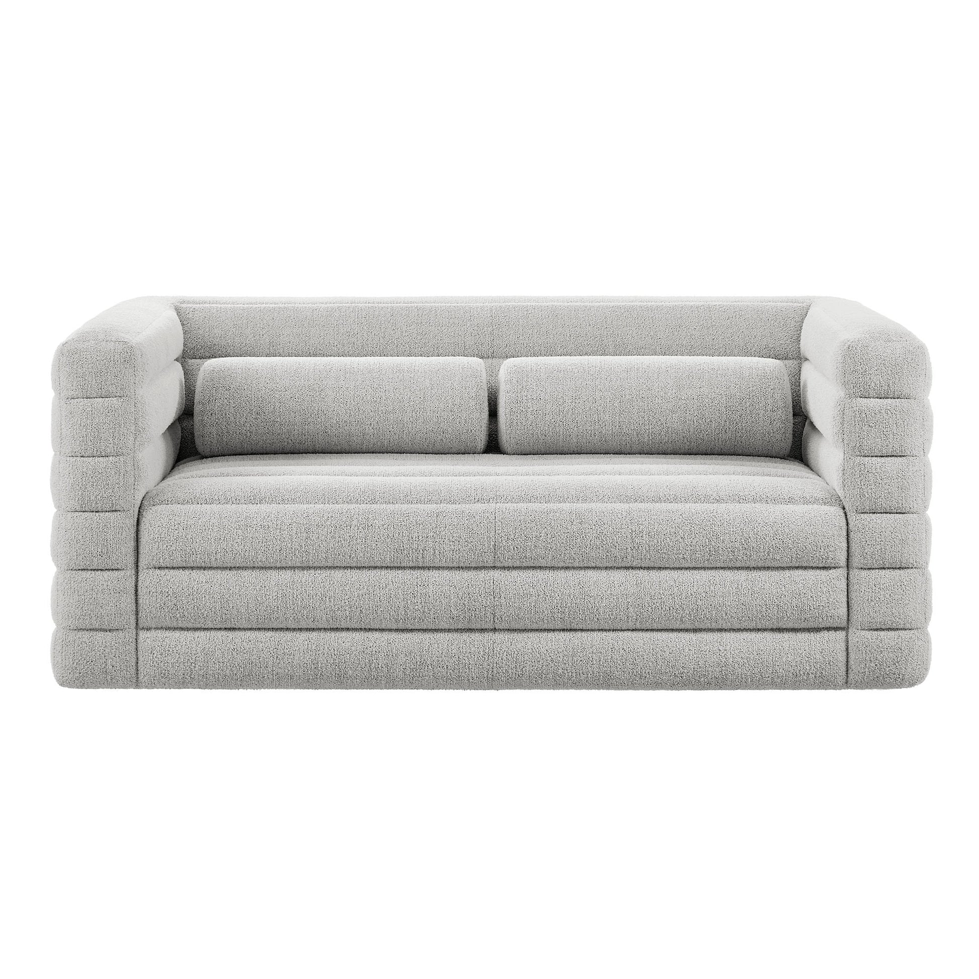 Light gray boucle upholstered loveseat with chunky ribbed tubular arms, two back cushions, channel tufting, modern contemporary style.