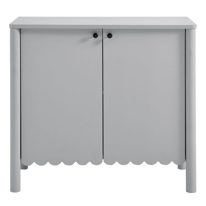 Gray cabinet with two doors, scalloped bottom edge, black knobs, rounded legs; versatile storage