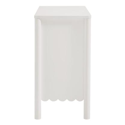 White scalloped 2-door sideboard cabinet with slim post legs, 35" wide.