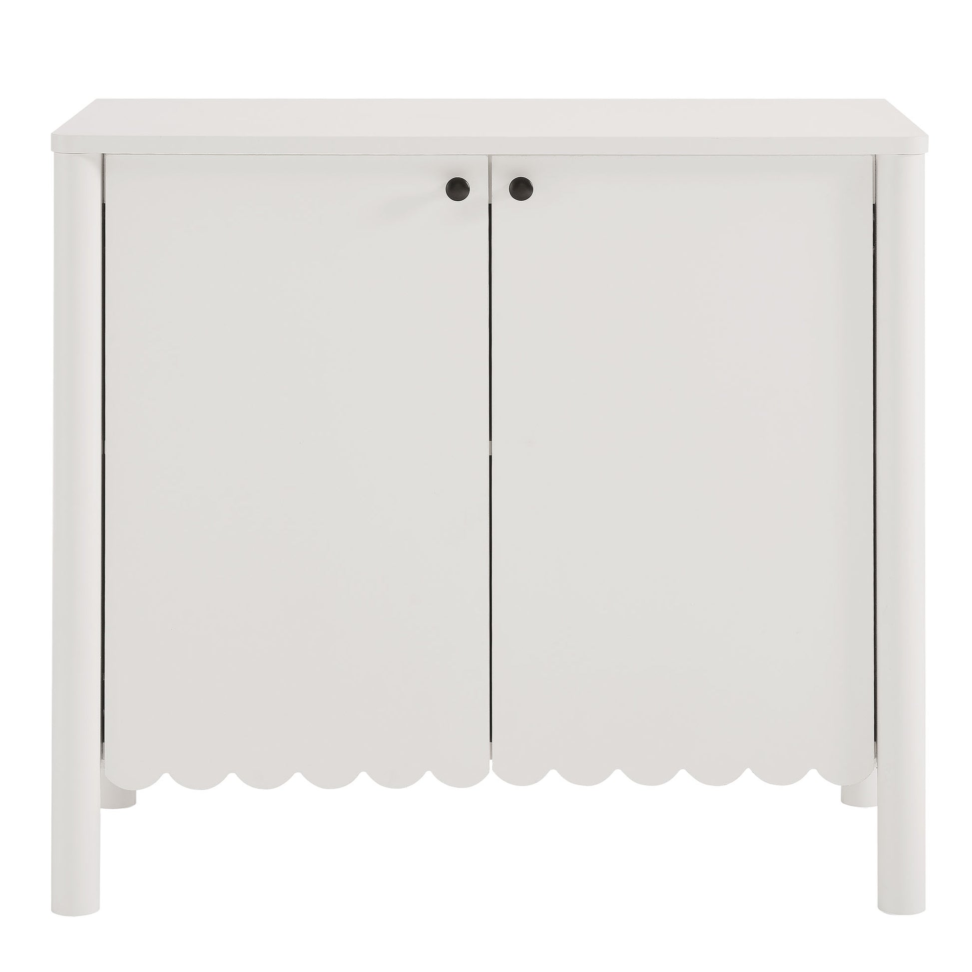 White wooden cabinet with two doors, scalloped bottom edge, and black round knobs for storage.