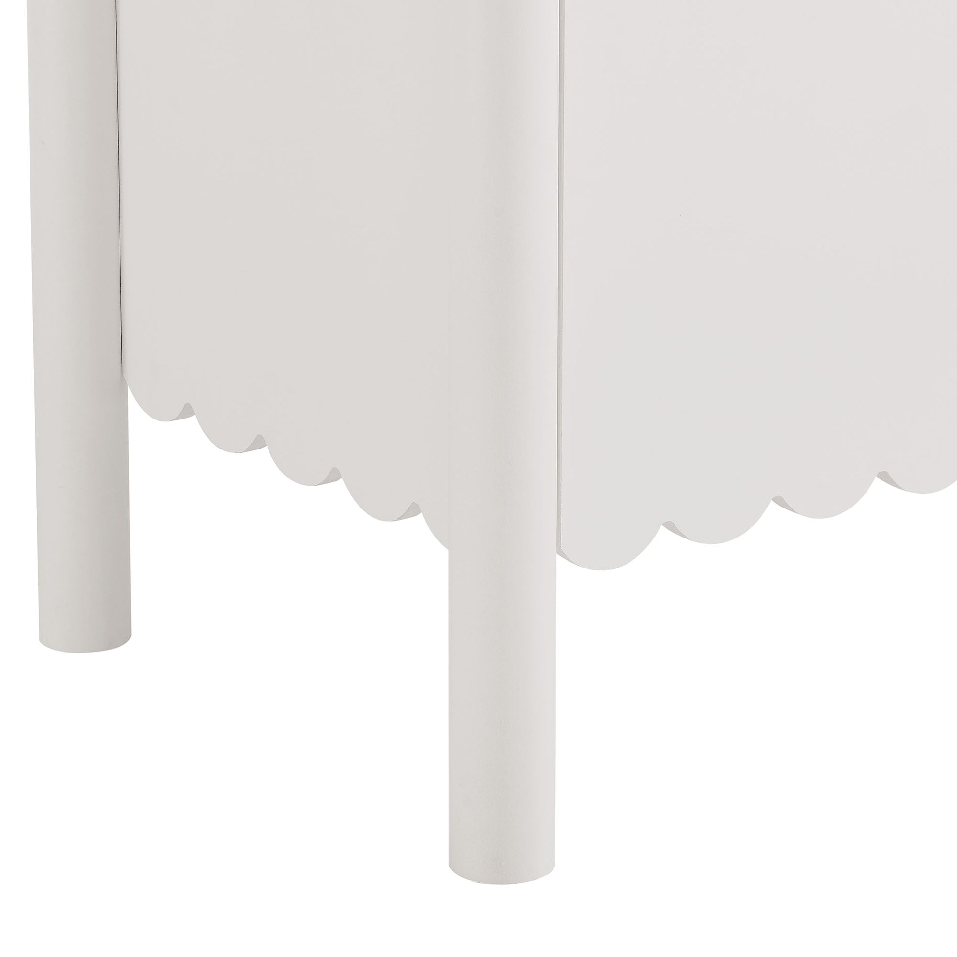 White wooden sideboard cabinet with cylindrical legs and scalloped bottom trim.