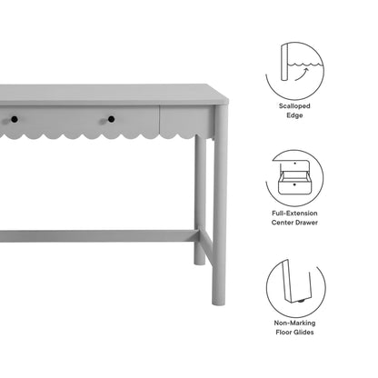 Light gray wooden desk with scalloped apron, full-extension center drawer, and non-marking floor glides.