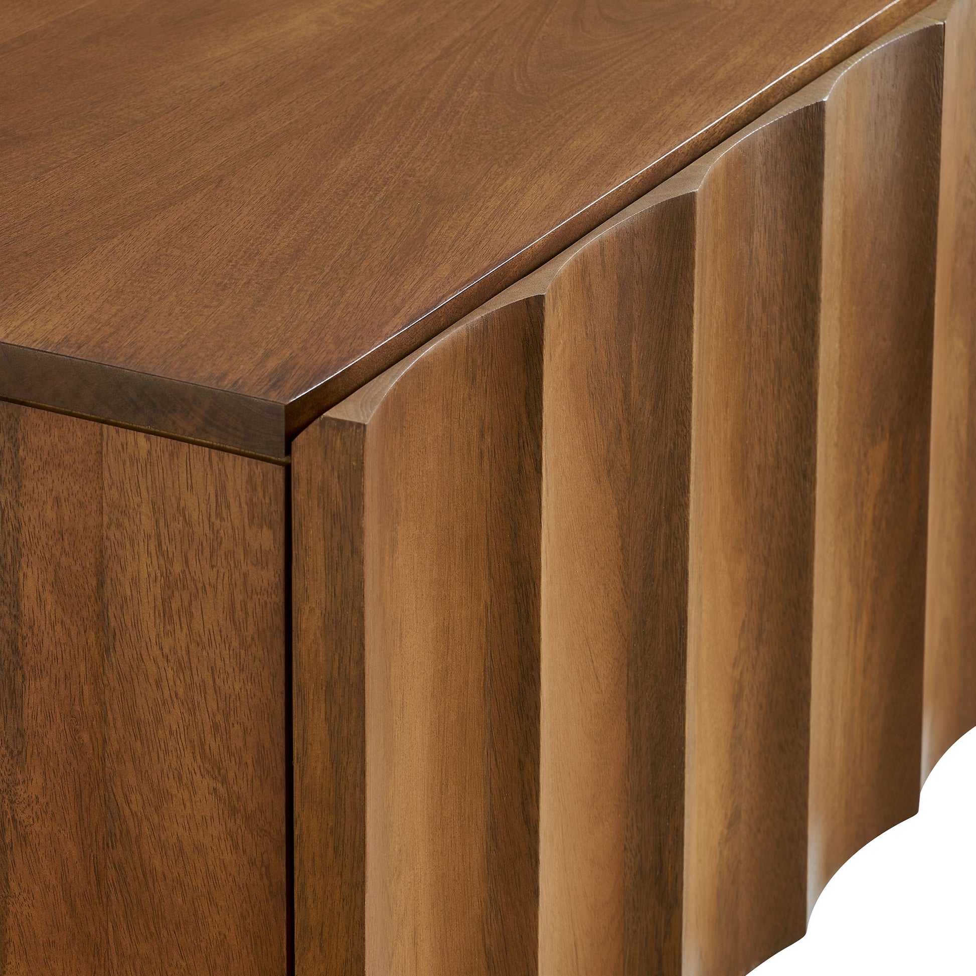 Walnut wood TV stand with vertical ribbed paneling along the front and a smooth rectangular top