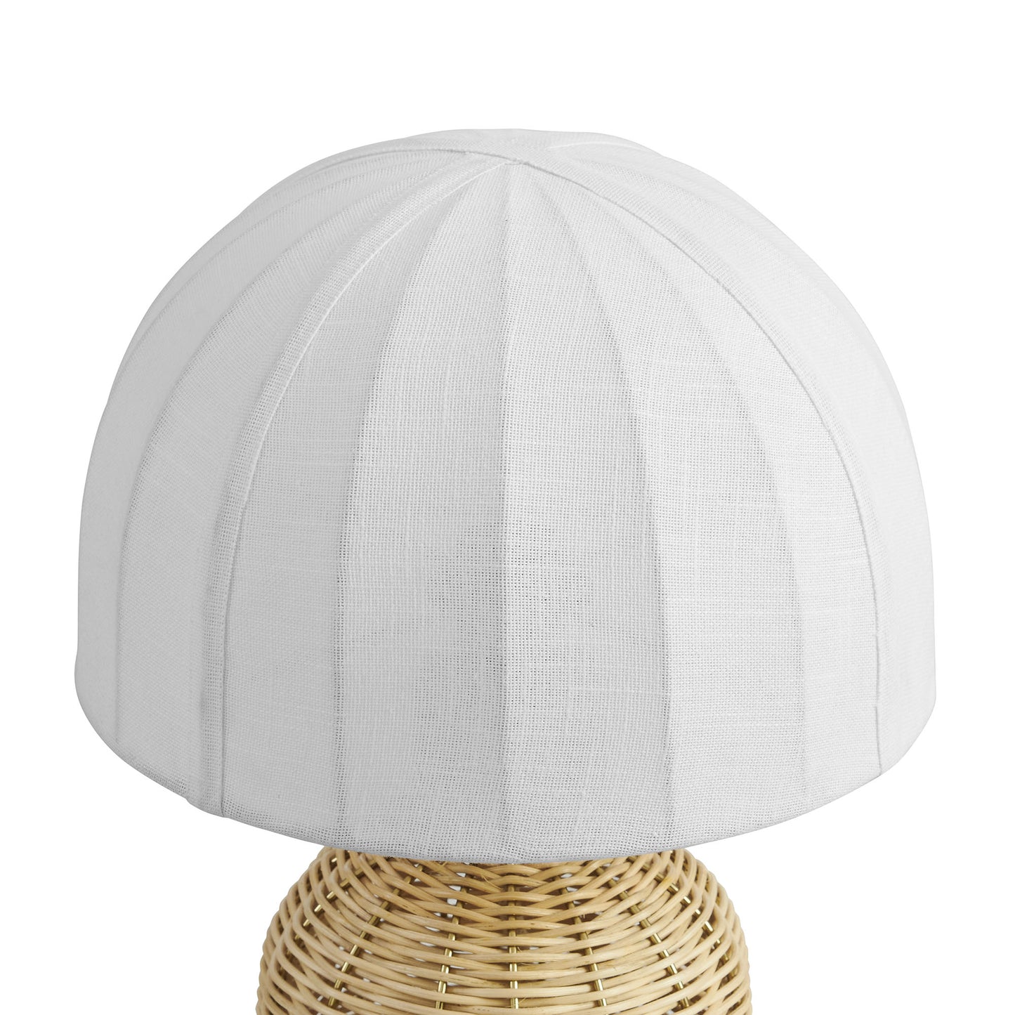 White fabric dome lampshade with vertical seam panels on a natural woven rattan table lamp base.