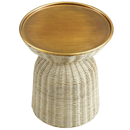 Natural rattan pedestal side table with a round brass top, boho rustic accent.