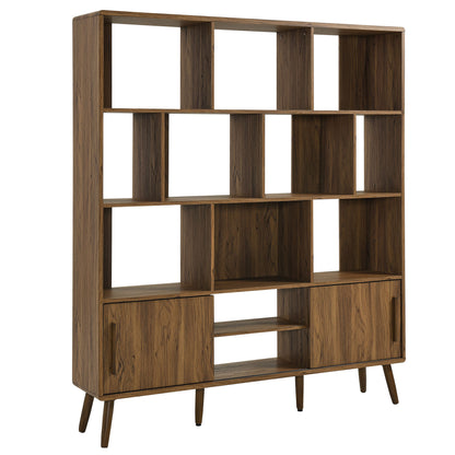 Walnut-finish mid-century bookcase with sliding doors, multiple open cubbies and tapered legs.