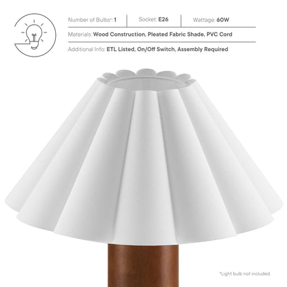 White pleated fabric lamp shade with scalloped rim atop a walnut wood base; modern rustic table lamp.