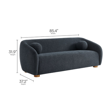 Navy blue fabric sofa with curved arms, two round cushions, and short wooden legs in a modern lounge style, 85.4in wide.