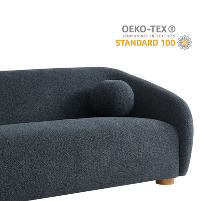 Dark navy woven fabric sofa with curved back, round bolster cushion, low wooden legs, modern living-room style.