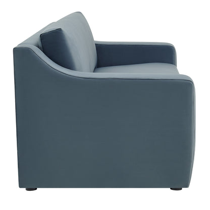 Side view of a blue-gray modern sofa with rounded arms, slim back cushion, and short feet.