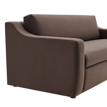 Brown velvet sofa with rounded arms and tailored cushions; contemporary living room seating.