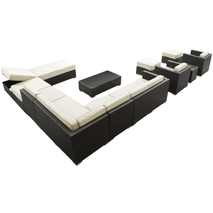 Outdoor modular sectional set with white cushions and dark wicker frame; includes ottomans and a coffee table.