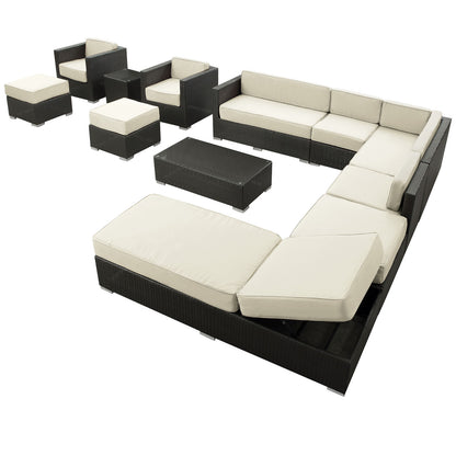 Dark woven outdoor sectional with ivory cushions, modular L-shaped sofa, matching ottomans, and rectangular wicker coffee table.