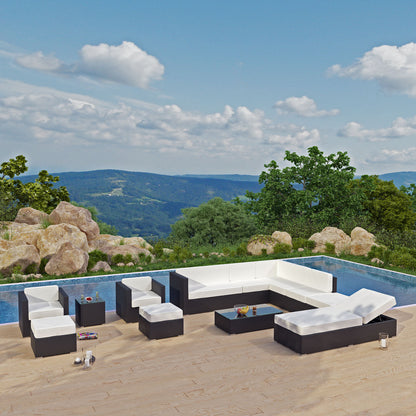 Espresso outdoor sectional set with white cushions and a glass-top coffee table, poolside on a stone deck with a panoramic hills backdrop.